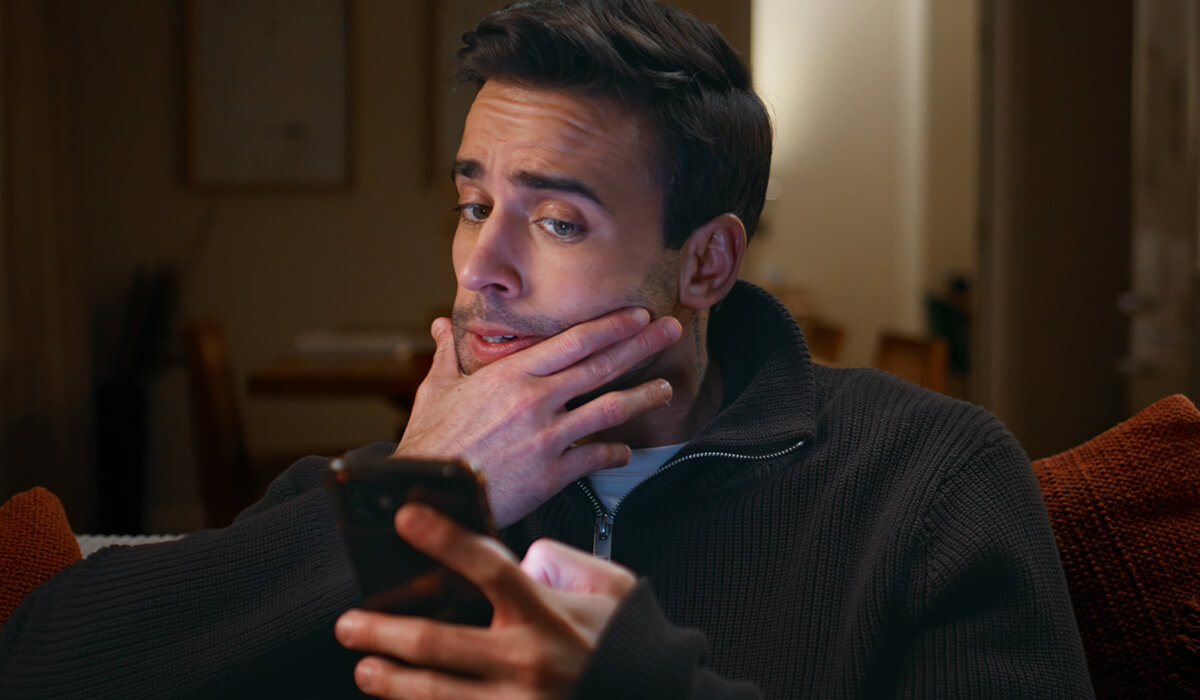 Man learning how to protect himself from phishing and smishing scams.